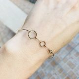 Bracelet avec des ronds bronze et or plaqué