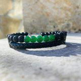 Bracelet Magali noir Bracelet Magali noir - unisexe avec tourmaline et pierre de lava, cuir noir tressé Bracelet Magali pour lui et pour elle avec tourmaline et pierre de lava Bracelet Magali unisexe avec les pierres semi précieuses : tourmaline et pierre de lava, lanière tressée en cuir noir en double rangée, avec la chaine en acier inoxydable et une perle pour ajuster à la parfaite taille de votre poignée