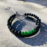Bracelet Magali noir Bracelet Magali noir - unisexe avec tourmaline et pierre de lava, cuir noir tressé Bracelet Magali pour lui et pour elle avec tourmaline et pierre de lava Bracelet Magali unisexe avec les pierres semi précieuses : tourmaline et pierre de lava, lanière tressée en cuir noir en double rangée, avec la chaine en acier inoxydable et une perle pour ajuster à la parfaite taille de votre poignée