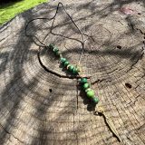 Collier Onésime repositionnable pour homme, accessoire idéal ajustable et modifiable en longueur avec l'oeil de tigre vert